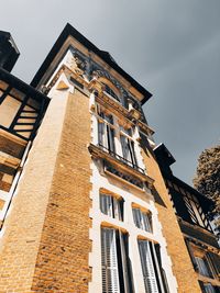 Low angle view of old building against sky