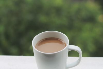 Close-up of coffee cup on table