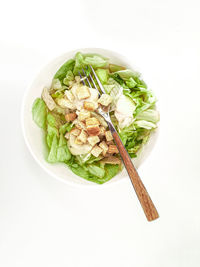 High angle view of salad in bowl against white background