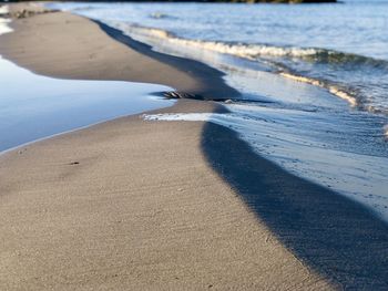 Shadow of people on beach