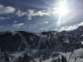 Panoramic view of snowcapped mountains against sky