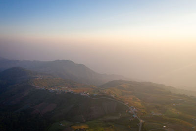 High angle view of mountains against sky during sunset