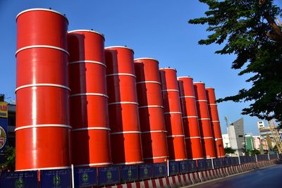 Low angle view of industry against sky in city