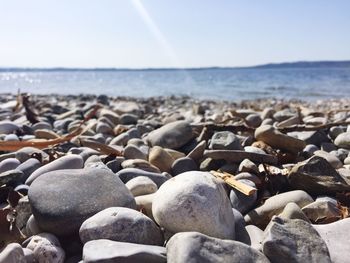 Rocks on beach against sky