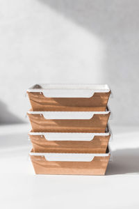 Close-up of stack on table against white background