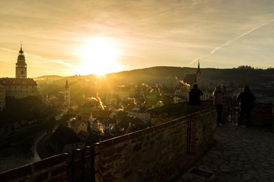 Silhouette of cesky krumlov castle and townscape during sunset