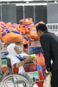 Rear view of people at market