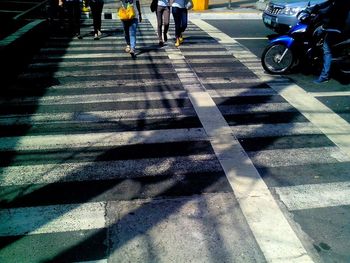 People walking on road in city