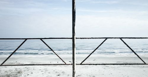 Low angle view of ship sailing on sea against sky