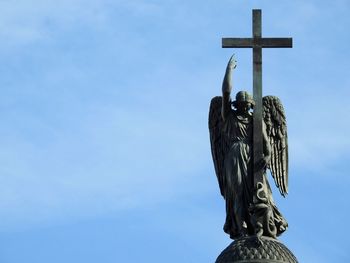 Low angle view of statue against sky