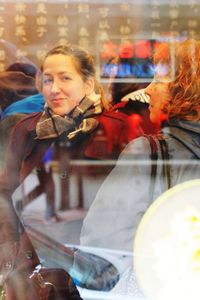 Reflection of woman in mirror at night