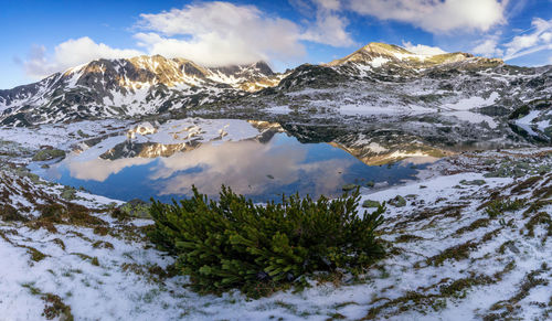 Scenic view of snowcapped mountains against sky