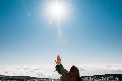 Sun shining through man