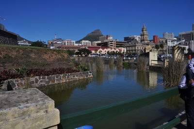 Buildings in town against sky