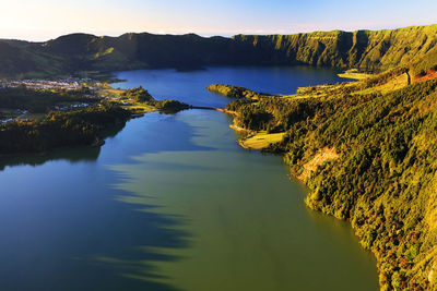 Scenic view of lake amidst landscape at azores during sunset