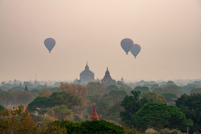 View of hot air balloons against sky