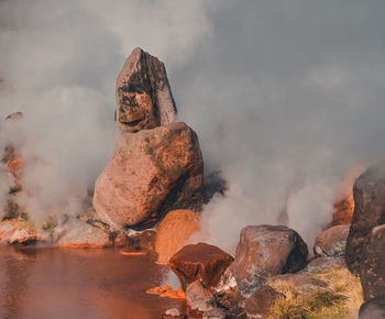 Rock formation on rocks against sky