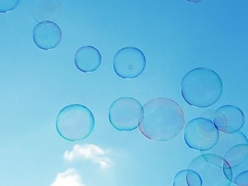 Low angle view of bubble against sky