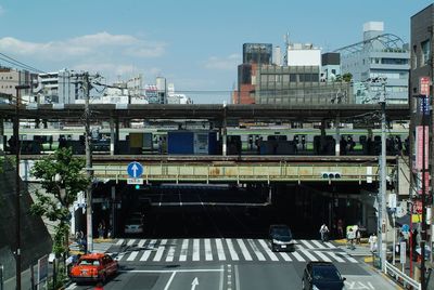 High angle view of train in city against sky