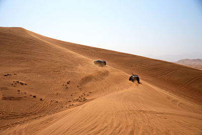 Scenic view of desert against clear sky