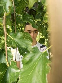 Portrait of young man using mobile phone