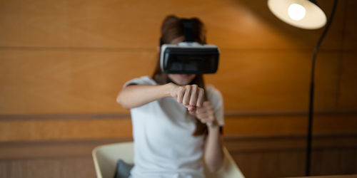 Midsection of woman using mobile phone