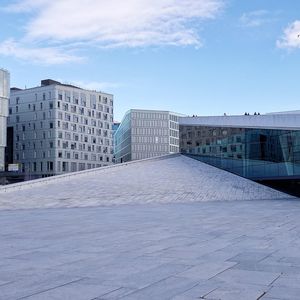 Buildings in city against sky