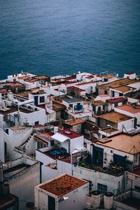 High angle view of townscape by sea