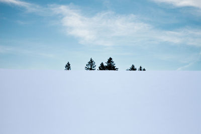 Scenic view of snow covered landscape against sky