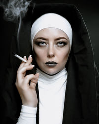 Portrait of a woman smoking cigarette