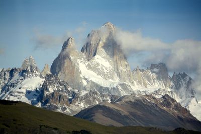 Snow covered peaks of a steep high mountain