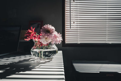 Close-up of flower vase on table