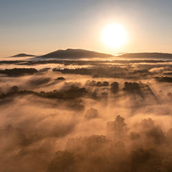 Scenic view of mountains against sky during sunset