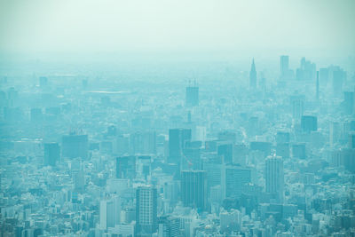 High angle view of buildings in city against sky