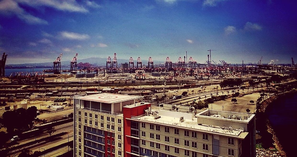 sky, architecture, built structure, cityscape, no people, transportation, building exterior, cloud - sky, day, high angle view, city, outdoors, industry, road, skyscraper, nature