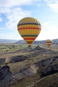 Hot air balloon flying over land