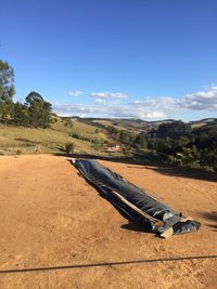 Scenic view of landscape against blue sky