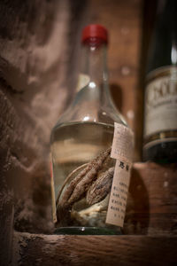 Close-up of wine bottles on table