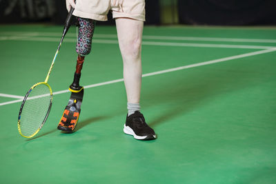 Girl with artificial leg playing badminton