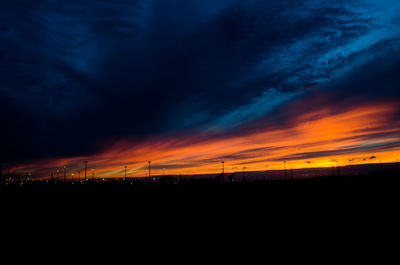 Silhouette of landscape against dramatic sky