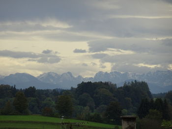 Scenic view of silhouette mountains against sky at sunset