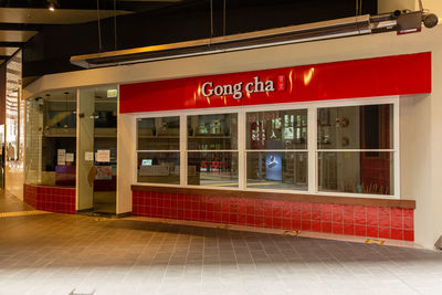 Illuminated sign on floor in city