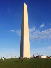 Low angle view of monument against blue sky