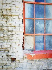 Close-up of window on brick wall