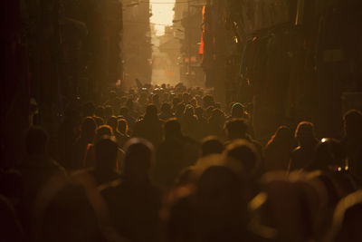 Crowded street at sunset