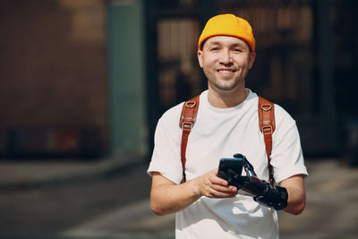 Portrait of young man using mobile phone