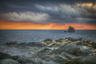 Scenic view of sea against sky during sunset