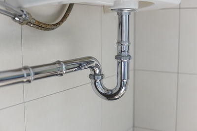 Close-up of faucet in bathroom