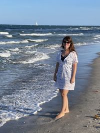 Woman standing on beach