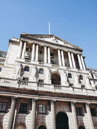 Low angle view of building against blue sky